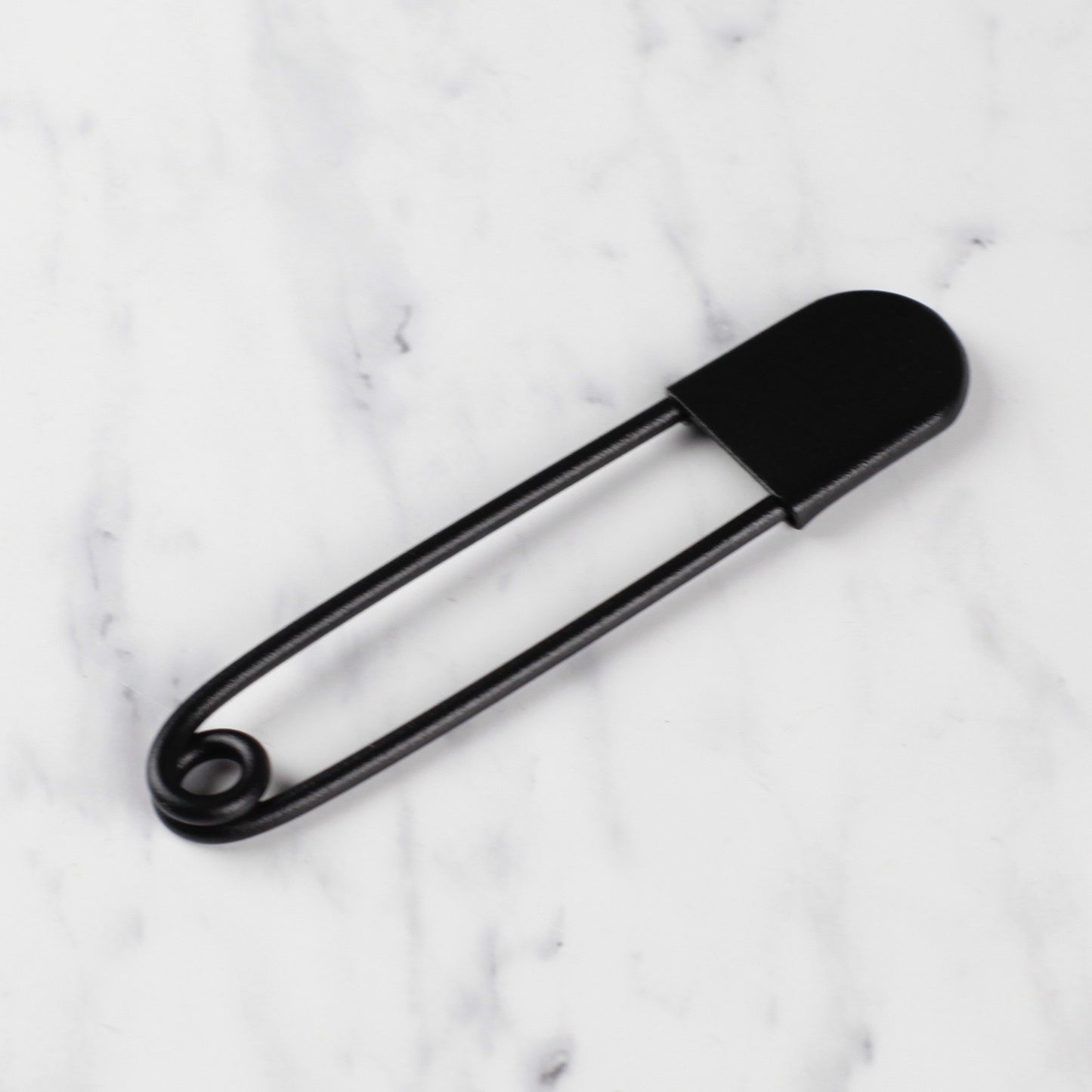 
                  
                    giant safety pin - textured matte black
                  
                