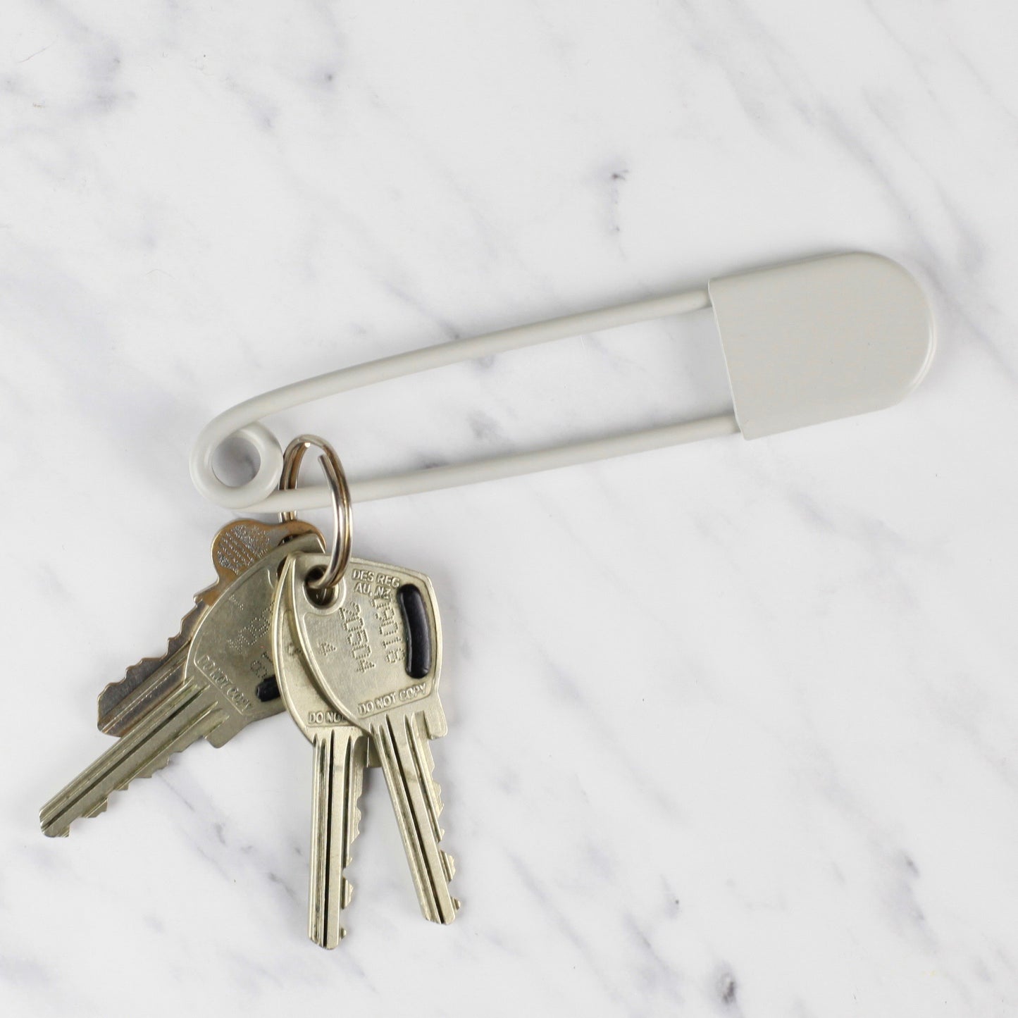 
                  
                    giant safety pin - offwhite
                  
                